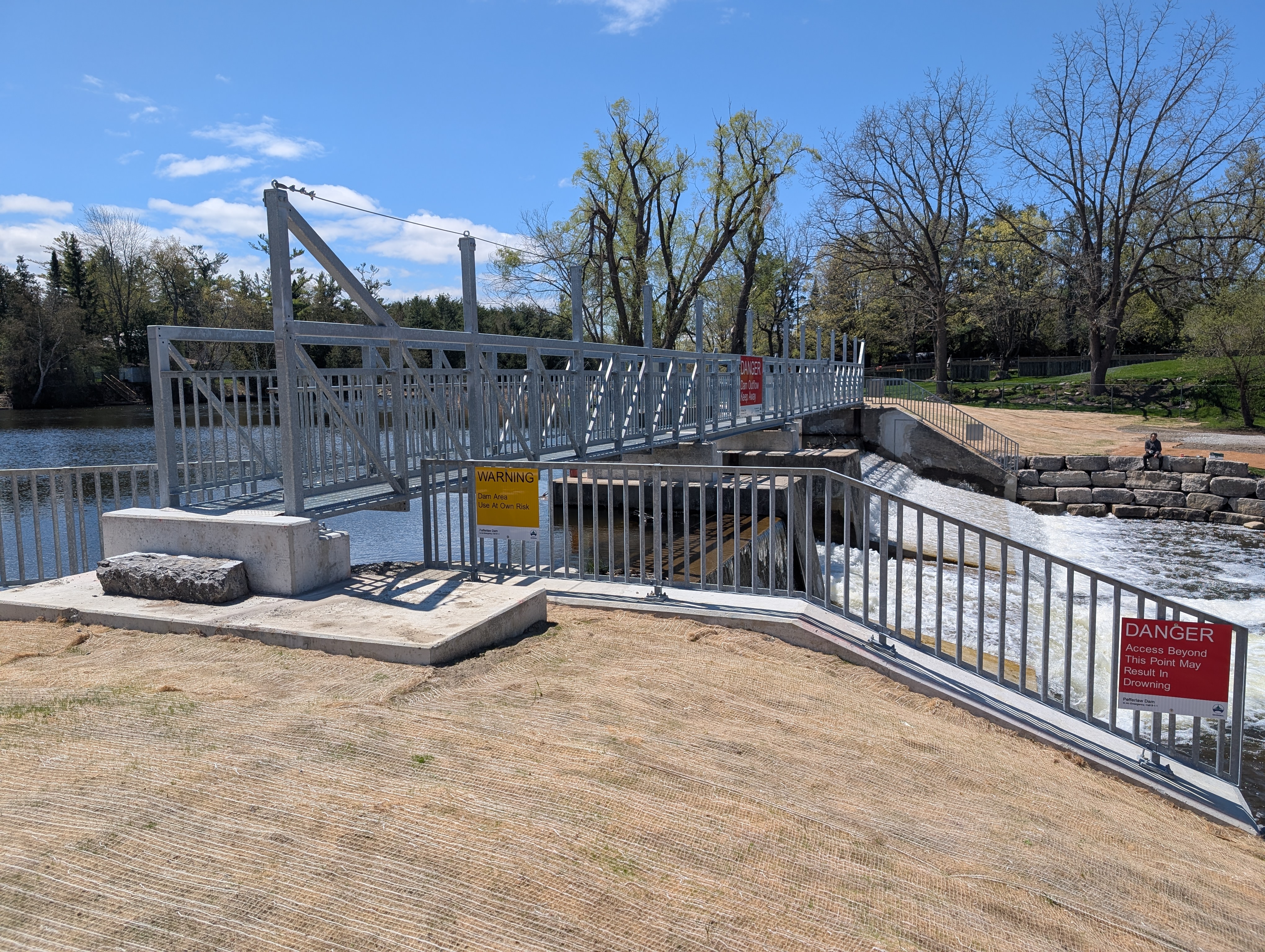 metal bridge over a dam 