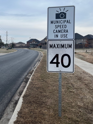 Sign stating Municipal Speed camera in use and a sign stating maximum 40 KM/hour